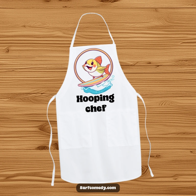 Funny fish performing a hoop jump on a surfboard, designed for a humorous and functional chef apron. Great funny gift.