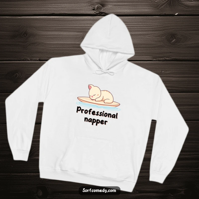 Funny hoodie showing a sleepy animal character peacefully napping on a surfboard in calm waters, offering cozy serenity.
