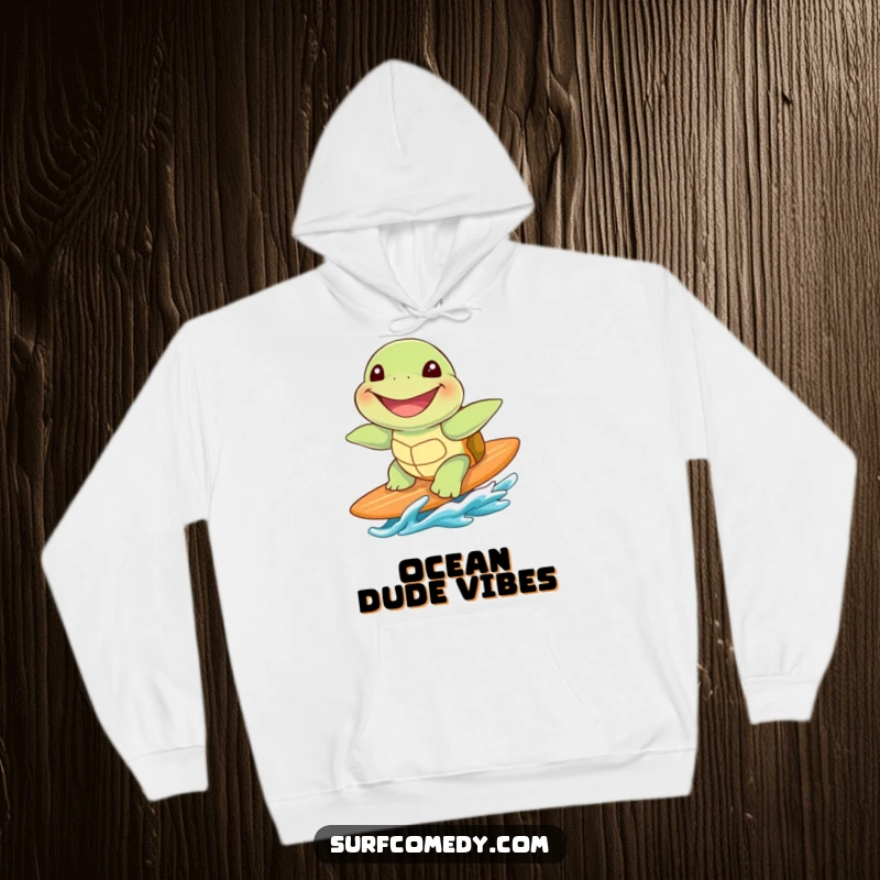 Funny cute sea turtle with a huge grin, riding a surfboard, depicted on a warm and cozy hoodie.