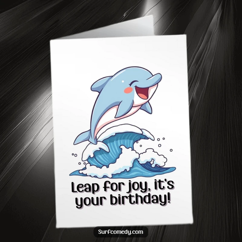 Funny free printable birthday card showing a happy dolphin mid-leap over a playful wave, bringing ocean-themed joy.