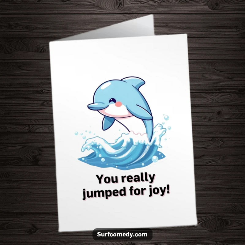 Funny Free Printable Congrats Card featuring a happy kawaii dolphin character jumping from a sparkling wave.