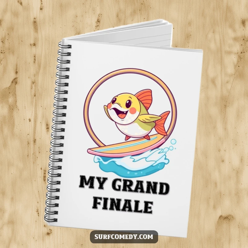 Funny fish attempting a hoop jump on a surfboard, featured on a notebook for creative and humorous entries. A fun funny gift.