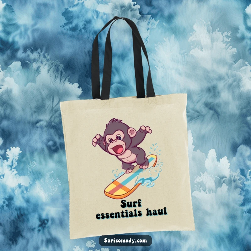 Funny tote bag showcasing a cool gorilla making a splashy dive from a surfboard into clear blue water.